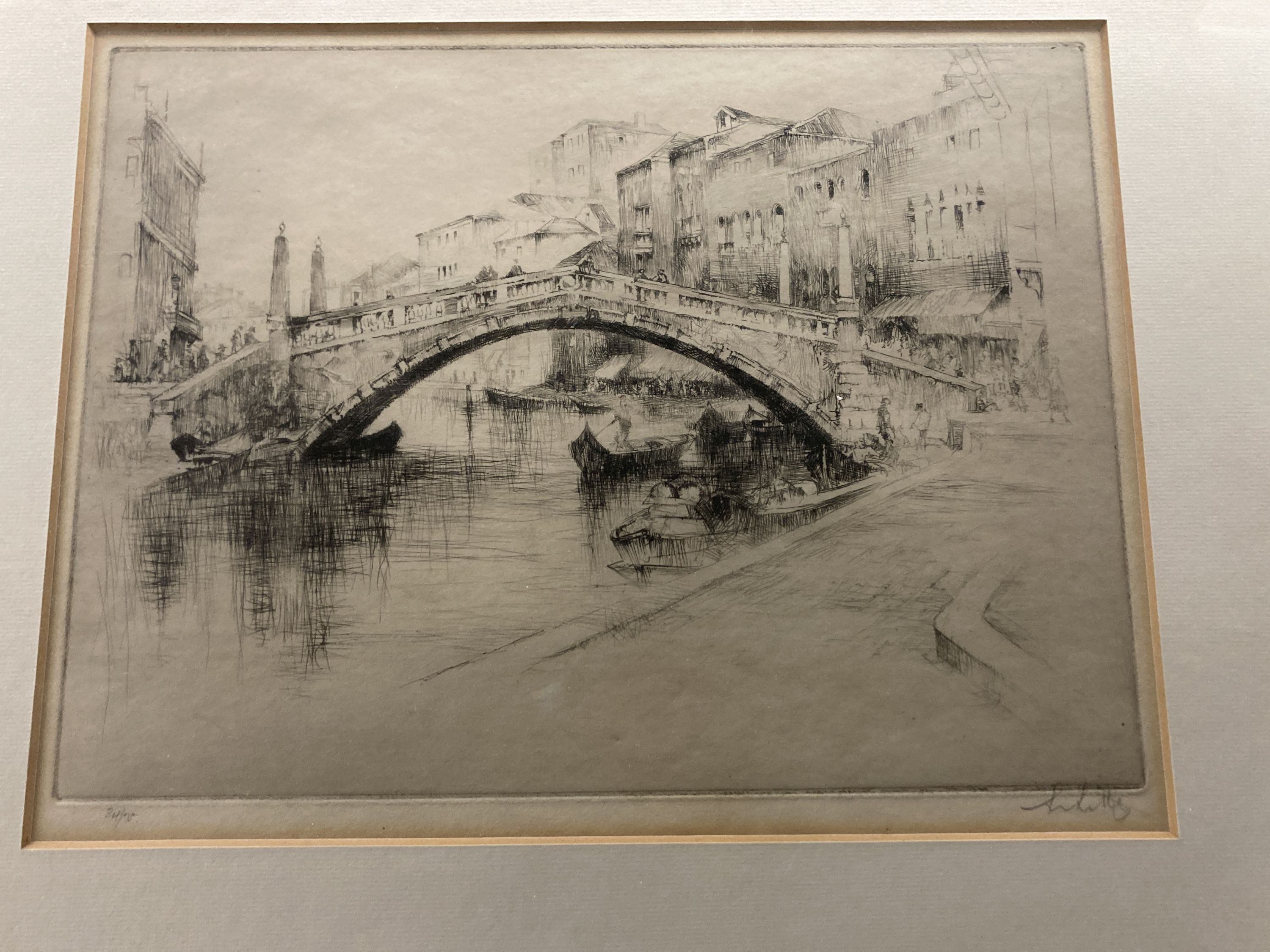 An early 20th century etching of the Rialto Bridge, Venice, indistinctly signed, 22 x 30cm and a coloured engraving of St Pauls Cathed